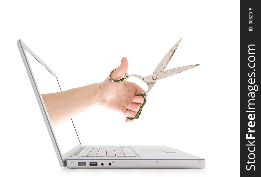 Man's hand with scissors from the laptop. Man's hand with scissors from the laptop.
