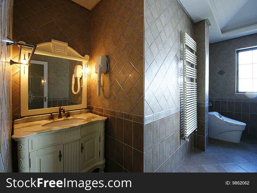 Bright and comfortable modern bathroom in a house. Bright and comfortable modern bathroom in a house.