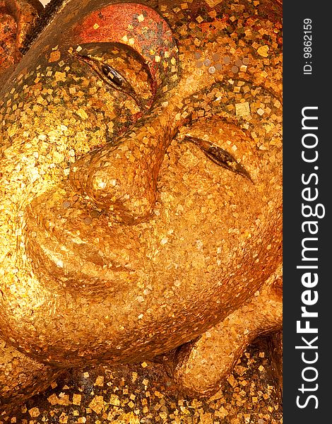 Reclining Buddha Image Covered With Gold Leaves