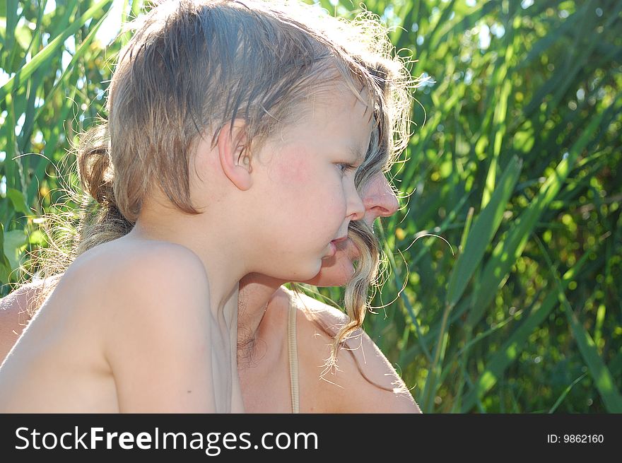 Mother and son on the summer beach