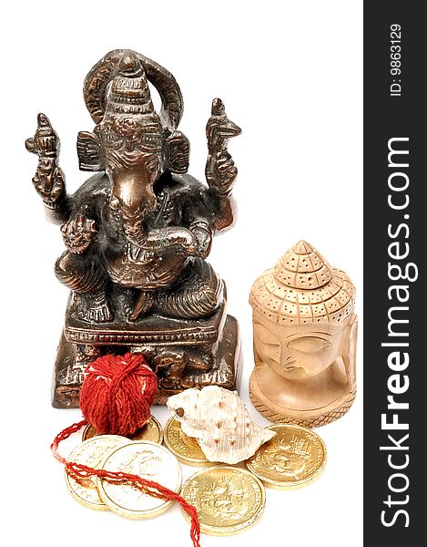 Lord Ganesha and Buddha with offerings isolated on white background.