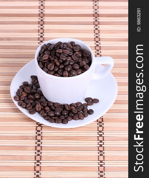 Coffee cup with coffee beans