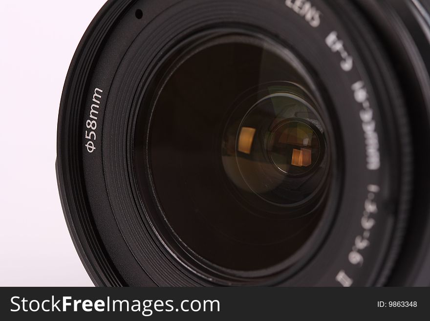 Close-up of a lens for digital camera on white background