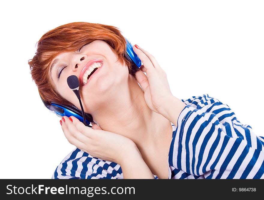 Beautiful blue-eyed girl with headphones on laughing. Beautiful blue-eyed girl with headphones on laughing
