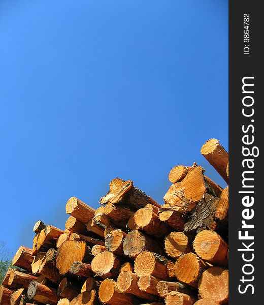 Reddish drying pine lumber beneath an azure sky. Reddish drying pine lumber beneath an azure sky.
