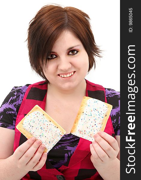 Beautiful seventeen year old teen girl holding two toaster pastries. Beautiful seventeen year old teen girl holding two toaster pastries.