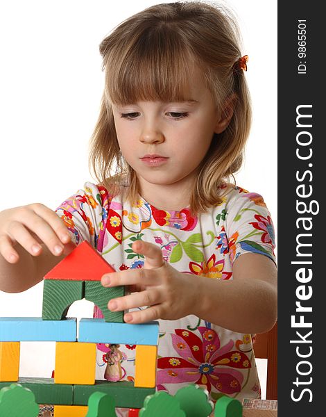 Little girl playing with cubes