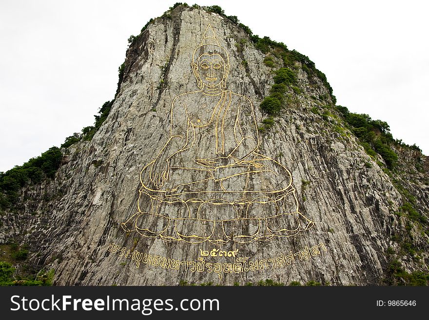 Buddha image engraving on mountain rock, Chonburi province, eastern Thailand. Buddha image engraving on mountain rock, Chonburi province, eastern Thailand