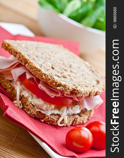 Healthy ham, cheese and tomato sandwich with bean sprouts