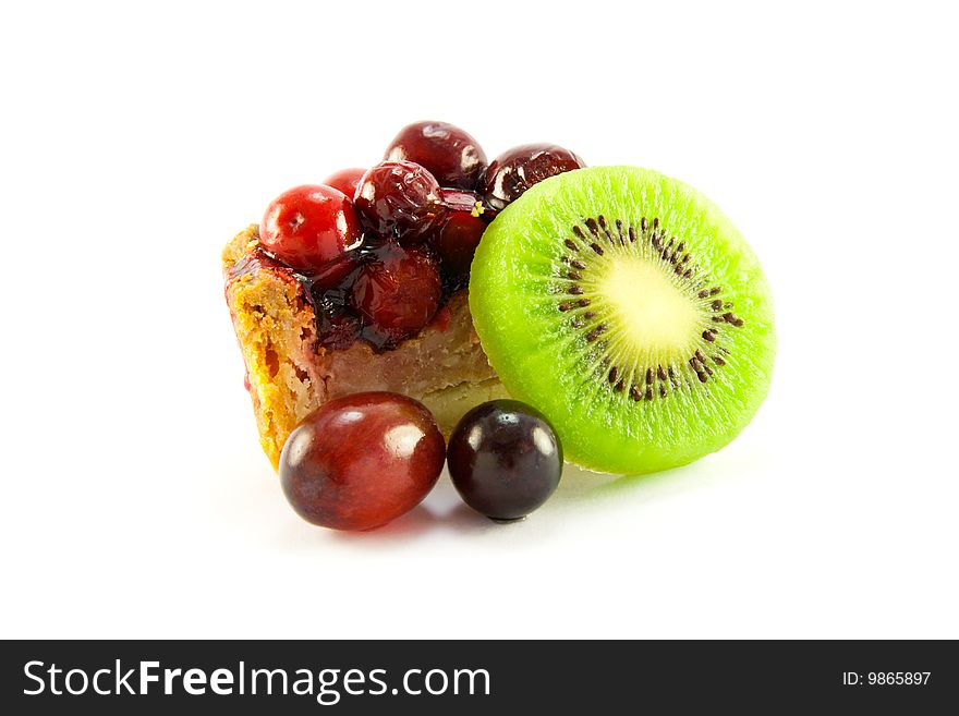 Slice of pork pie with kiwi and grapes with clipping path on a white background