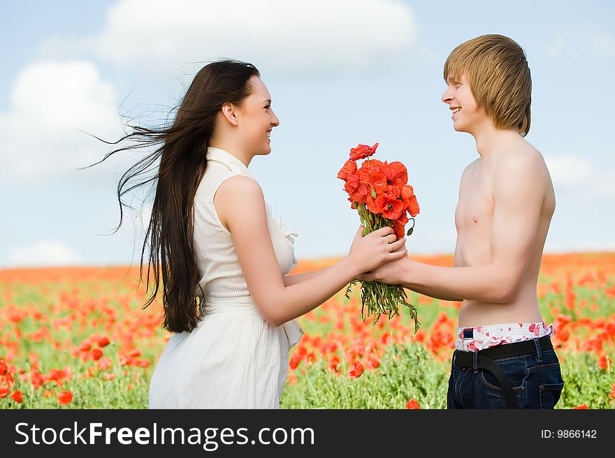 Lovely Couple In The Poppy Field