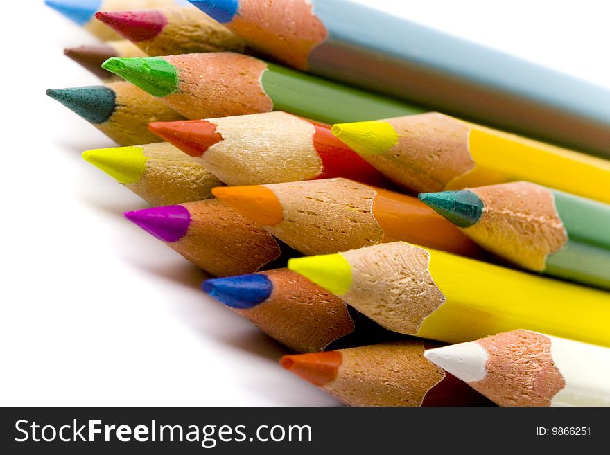 Color pencils closeup on white