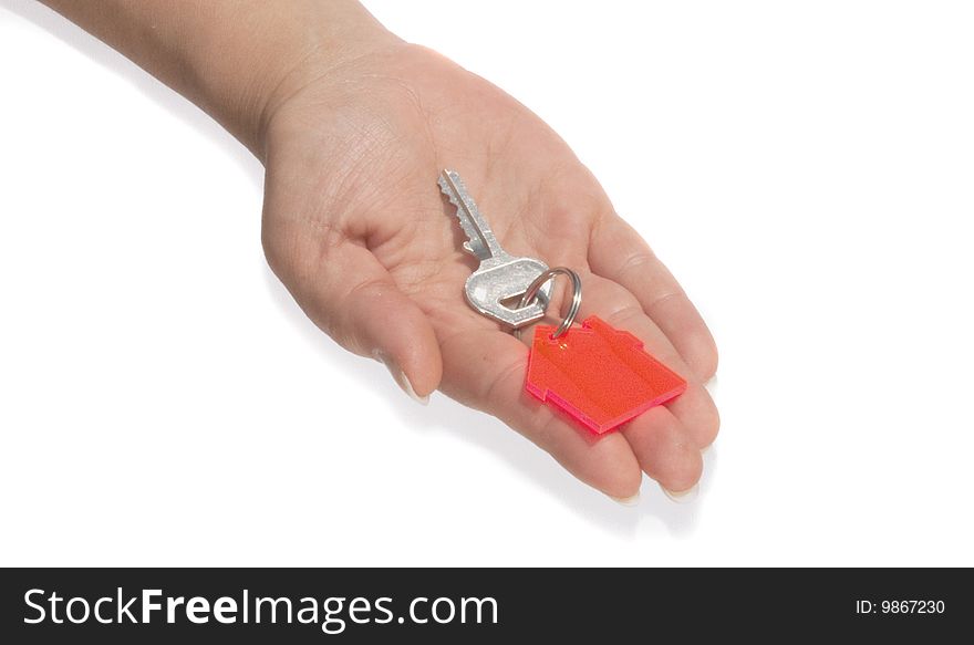 Hand and house key on white. Hand and house key on white