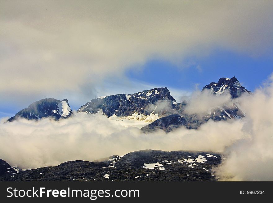 Rustic view of Mountains with clouds in the Yukon