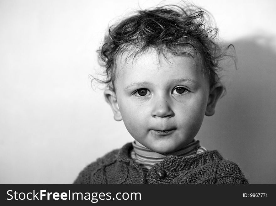 Assuming airs little boy with dishevelled hair before the camera