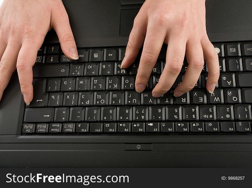 Close-up of female hands on the keyboard  typing documents. Close-up of female hands on the keyboard  typing documents