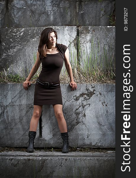 Beauty woman on stone steps under sky