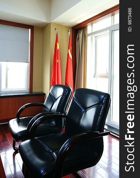 Office Seating Area With Chinese Flags