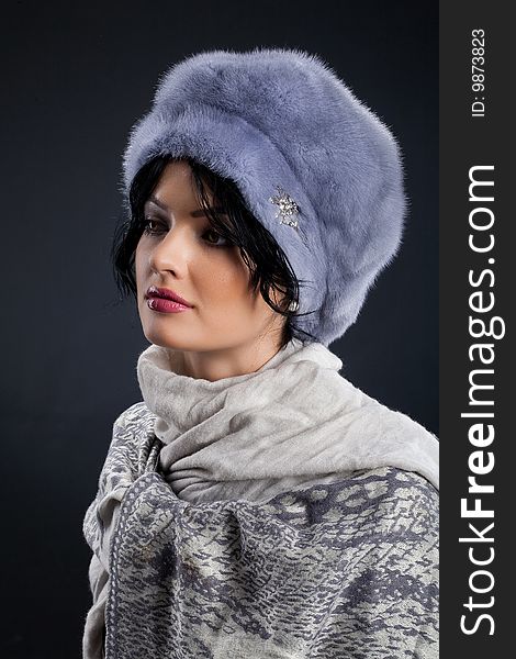 Young attractive woman in a fur hat