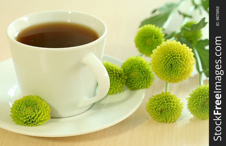 Cup of tea and green flowers. Cup of tea and green flowers