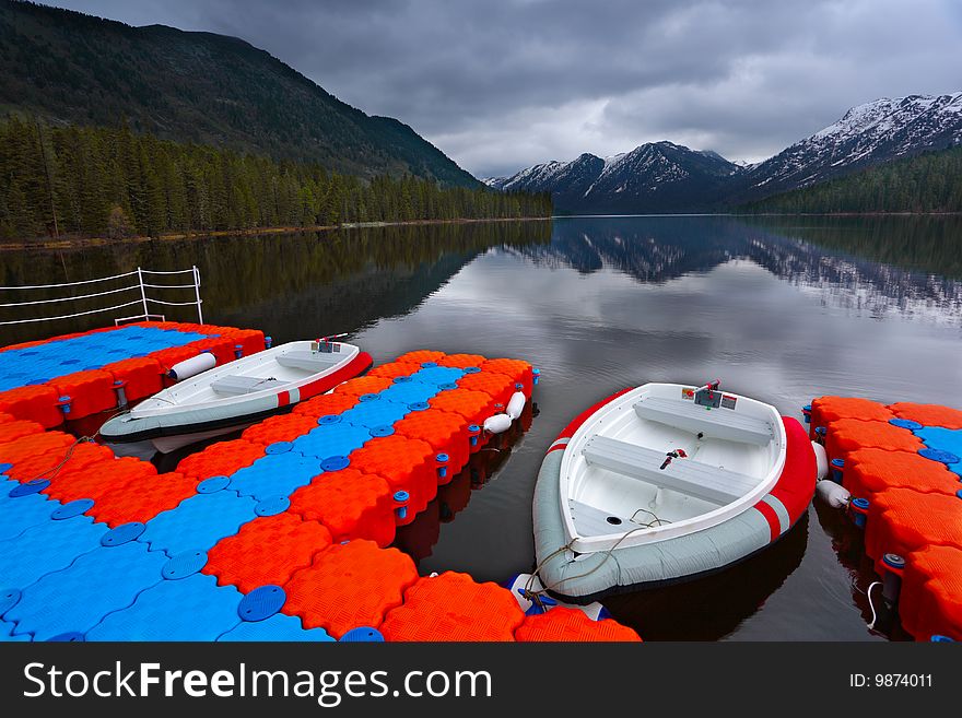 Boats on a mooring on mountain lake