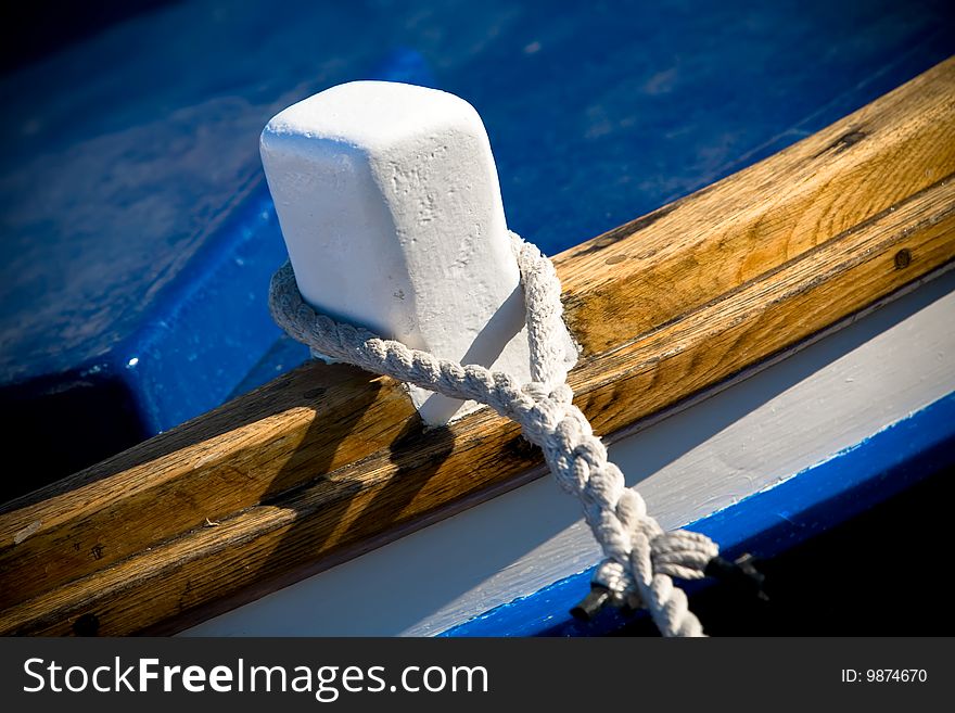 Close up of a bout tied up with a white rope. Close up of a bout tied up with a white rope.