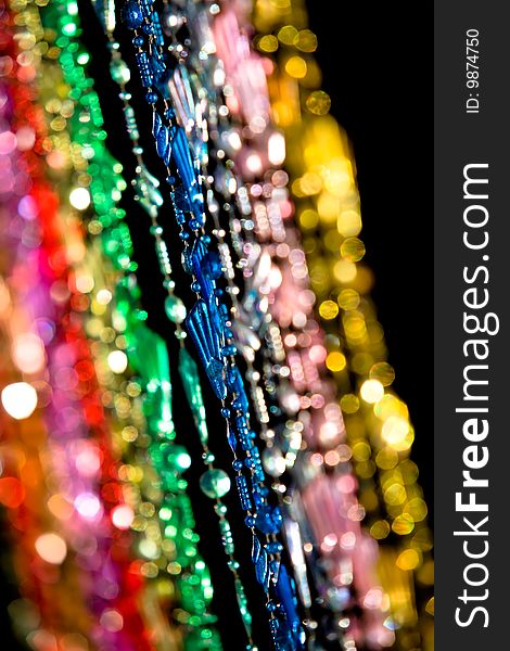 Colourful beads hanging in a doorway.