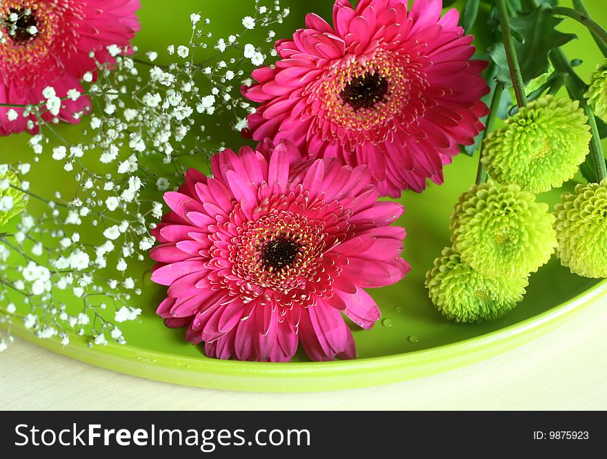 Spring bouquet on green plate