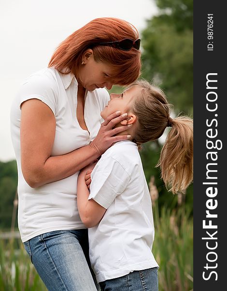 Mother and Daughter are happy in the park. Mother and Daughter are happy in the park