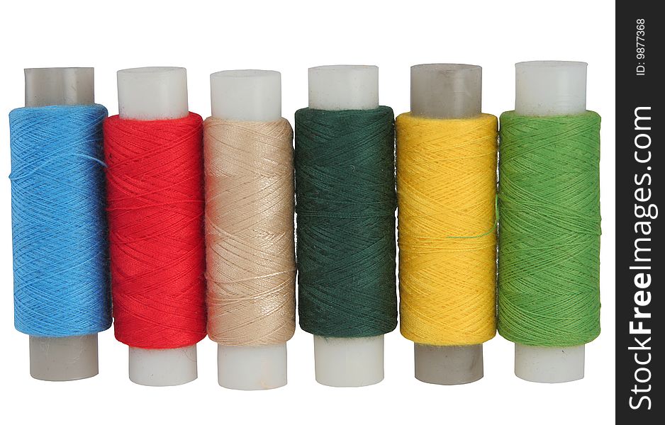 Set of colour threads for sewing on a white background
