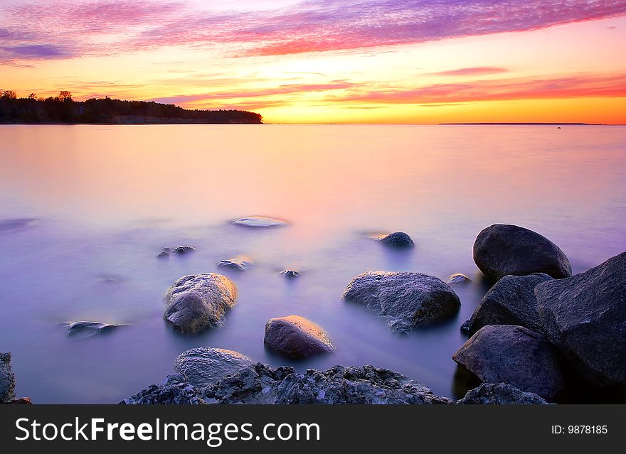 Beautiful sunset with sea and stones. Beautiful sunset with sea and stones