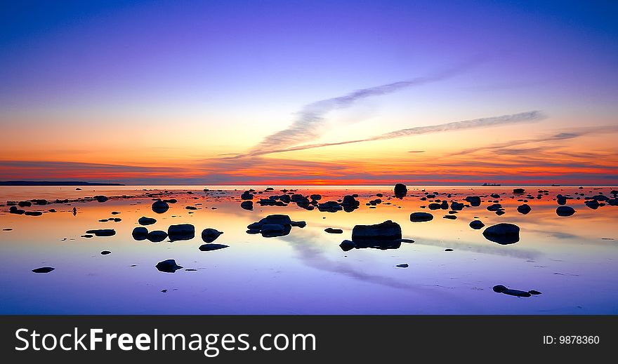 Beautiful sunset with sea and reflections