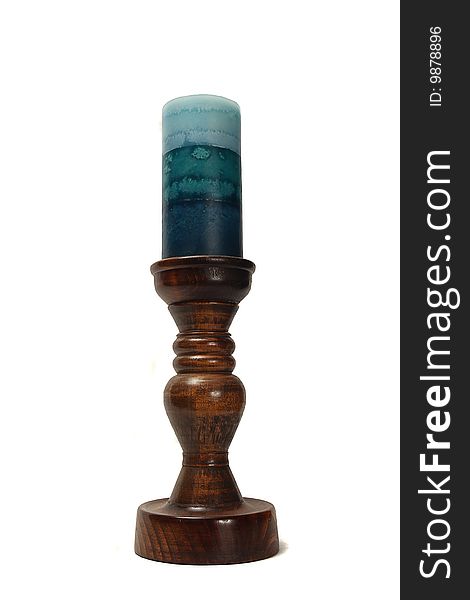 A candle on a wooden candlestick