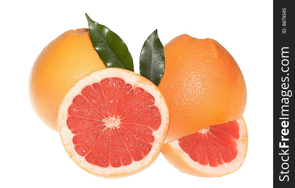 Fresh grapefruits with leafs on white background