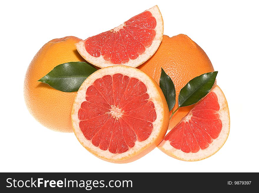 Fresh grapefruits with leafs on white background