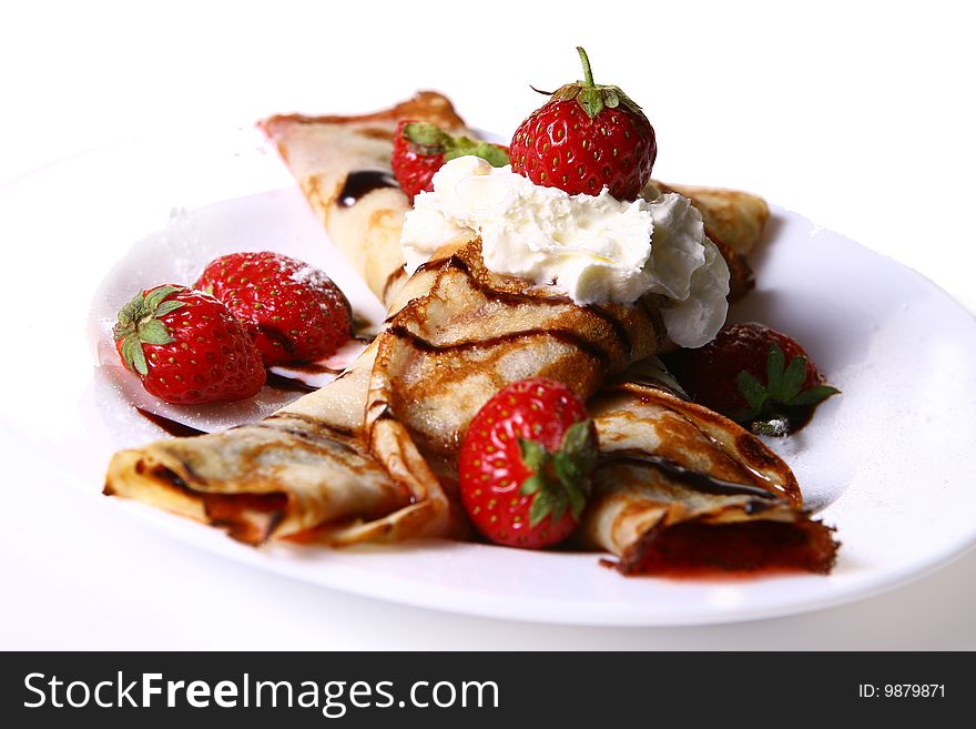 Dessert plate witn pancakes and strawberry