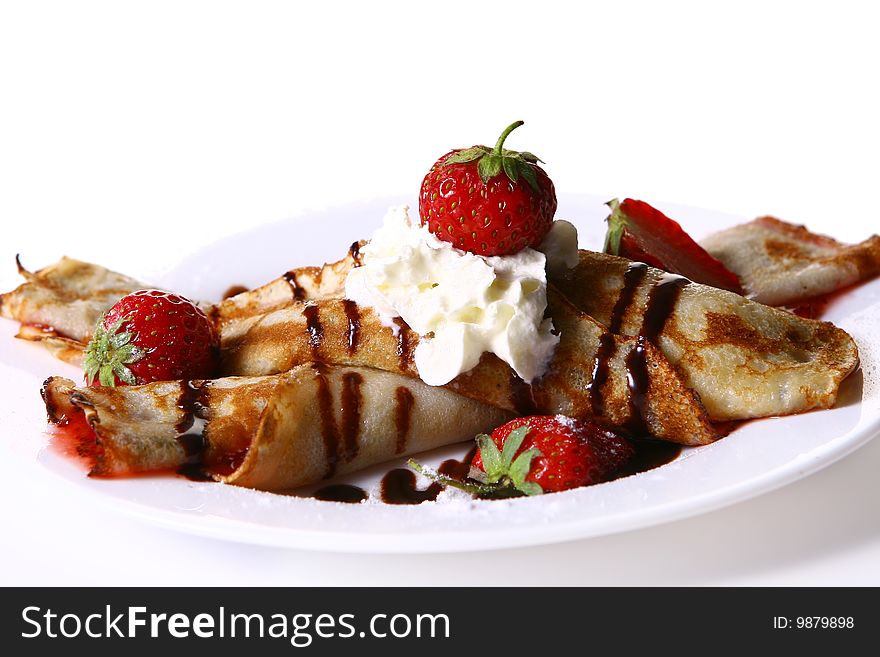 Dessert plate witn pancakes and strawberry