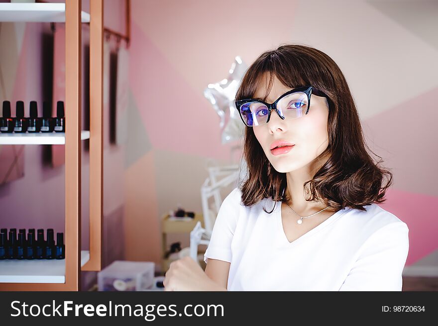 Portrait of a beautiful woman with pink lips in glasses. Portrait of a beautiful woman with pink lips in glasses.