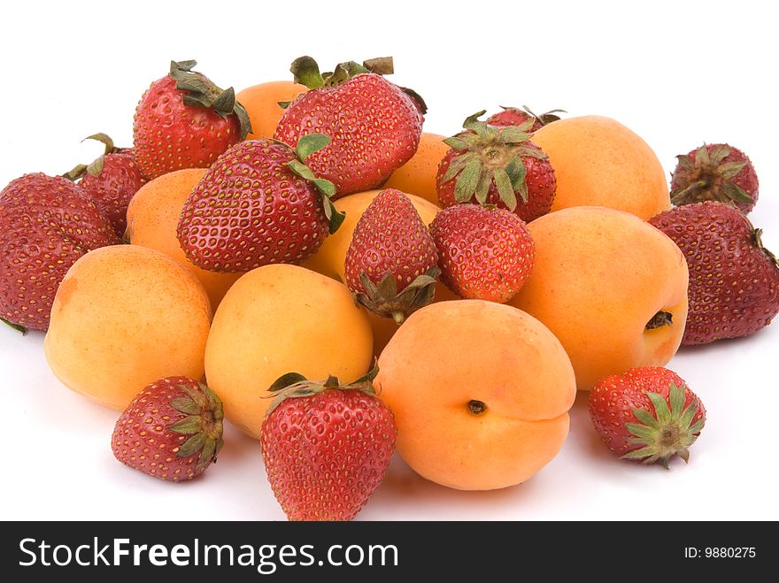Fresh fruit. Strawberry and peaches. Isolated on white