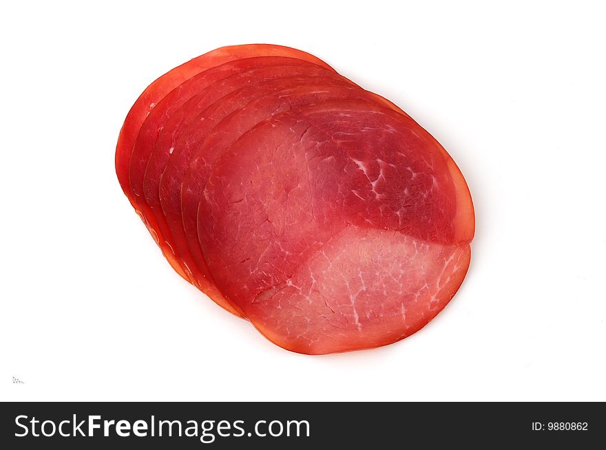 Slices of ham isolated on white background