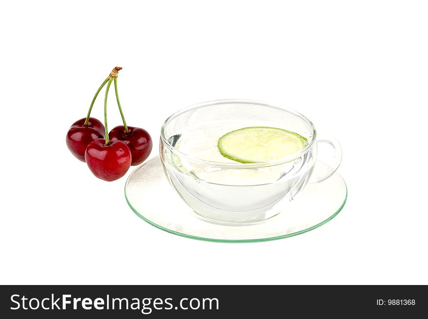 Cup of water with lemon and cherries, isolated on white background