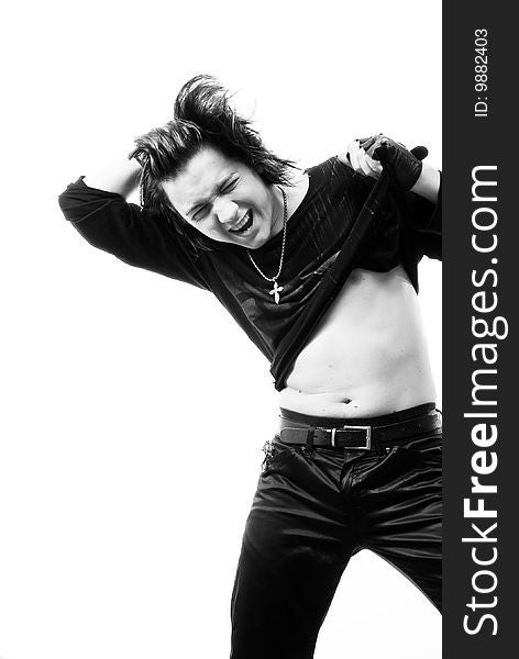 Black-and-white stylish studio portrait of long-haired young guy. Black-and-white stylish studio portrait of long-haired young guy