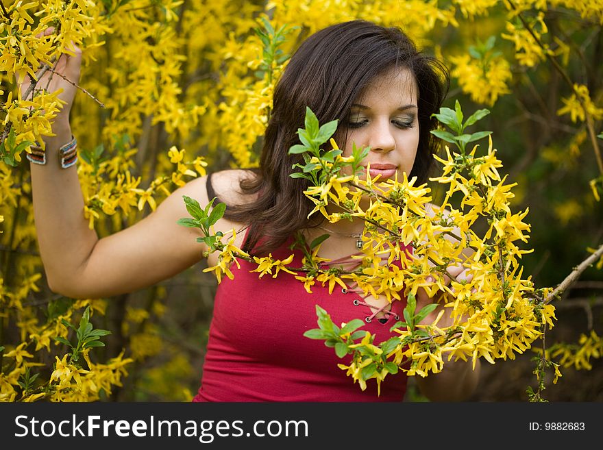 Woman in garden with yellow flowers