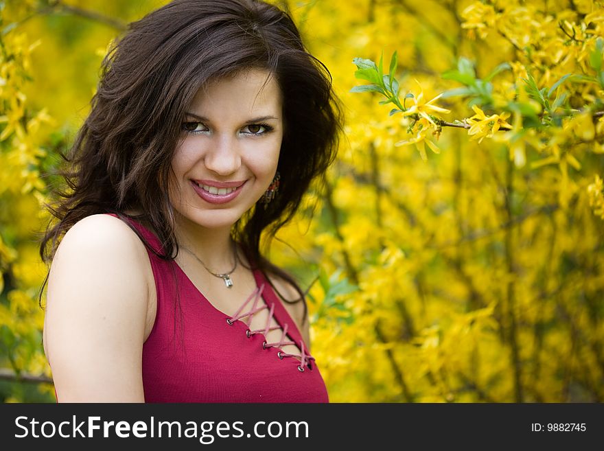 Woman in garden with yellow flowers