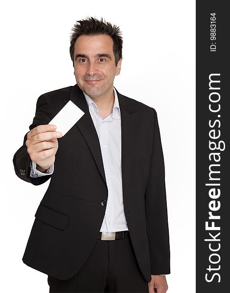 Businessman offers his personal card with grin. Businessman offers his personal card with grin