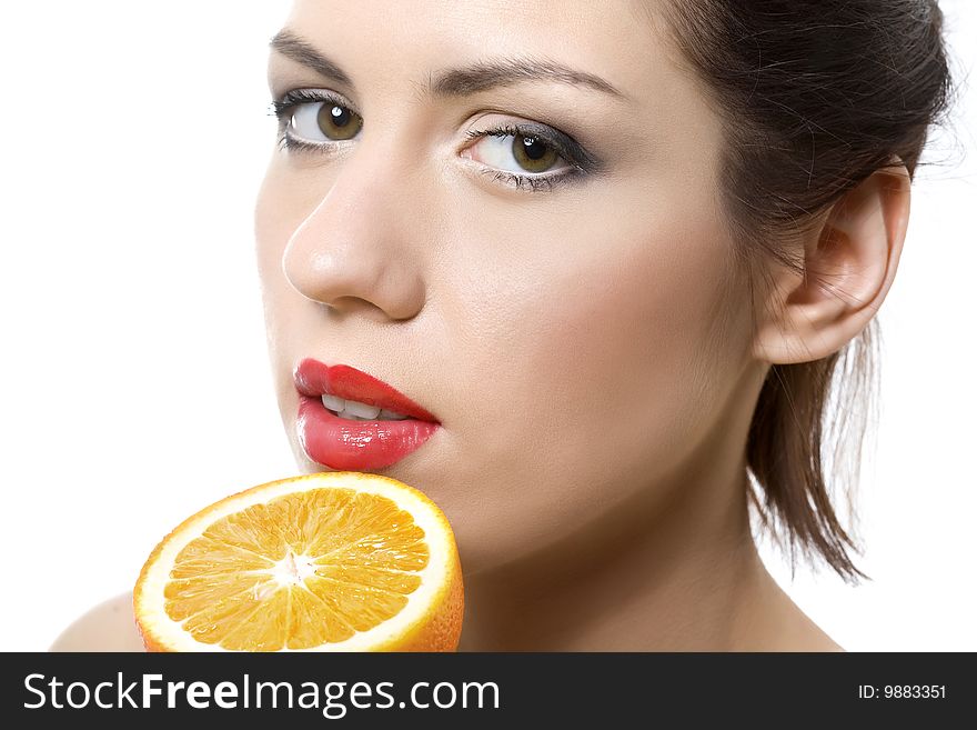 Closeup portrait of young woman with half of orange. Closeup portrait of young woman with half of orange