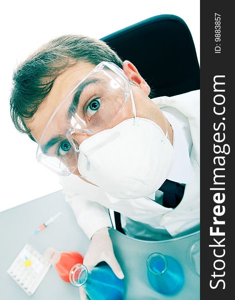 Medical theme: serious doctor working in a laboratory. Medical theme: serious doctor working in a laboratory.