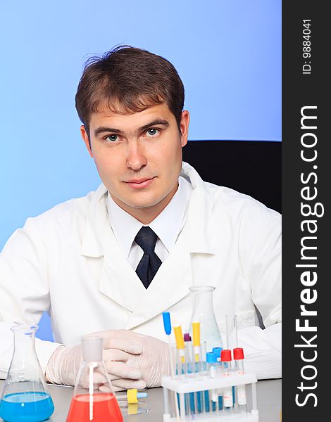 Medical theme: serious doctor working in a laboratory. Medical theme: serious doctor working in a laboratory.