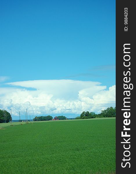 A picture of a landscape with clouds in the distance. A picture of a landscape with clouds in the distance.