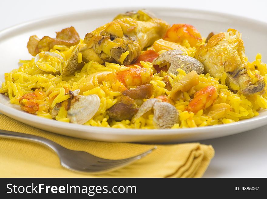 Delicious seafood paella and chicken rice yellow isolated